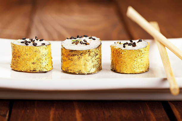 gold japanese sushi - food stock pictures, royalty-free photos & images