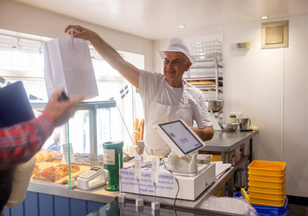 grabbing food to go - junk food stock pictures, royalty-free photos & images