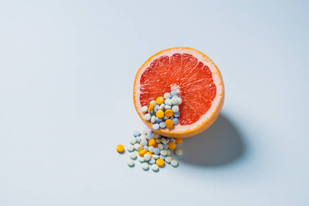 grapefruit and medicine - food stock pictures, royalty-free photos & images