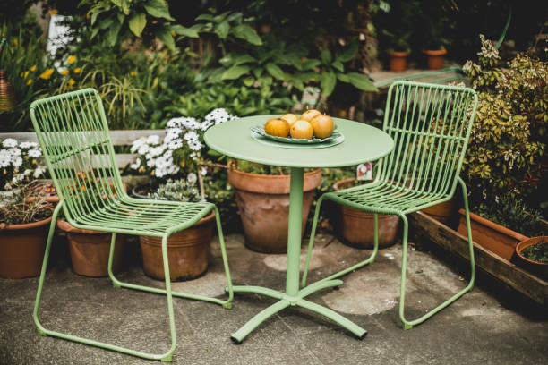 green garden furniture in a small garden. - home decoration stock pictures, royalty-free photos & images