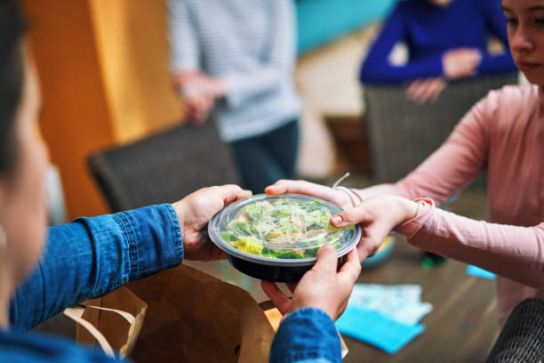 grilled chicken caesar salad bowl - junk food stock pictures, royalty-free photos & images
