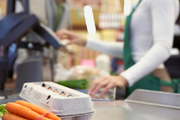 groceries on check out counter - food stockfoto's en -beelden