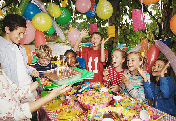 group children (9-12) at birthday party outdoors - garden decoration stock pictures, royalty-free photos & images