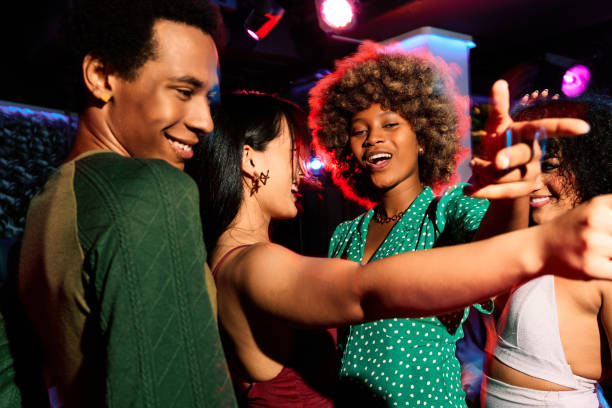 group of friends at the nightclub - concert stock pictures, royalty-free photos & images