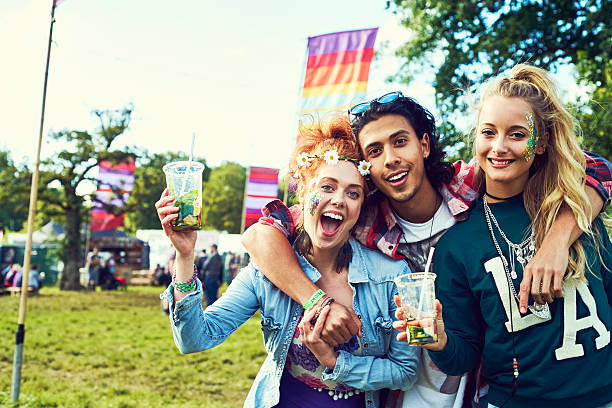 group of friends having fun at a music festival - concert stock pictures, royalty-free photos & images