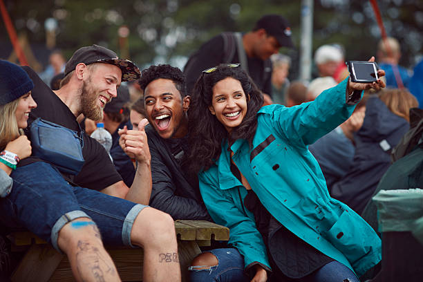 group of friends making selfie at festival - concert stock pictures, royalty-free photos & images