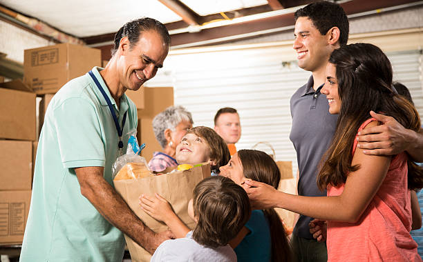 group of volunteers provide groceries donations to needy families. charity. - food stock pictures, royalty-free photos & images