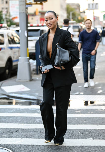 Guest is seen wearing a black Phillip Lim suit and black bag outside the 3.1 Phillip Lim show during NYFW S/S 2024 on September 10, 2023 in New York...