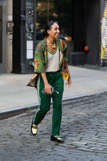 Guest is seen wearing a printed shirt and green pants outside the Head of State show during New York Fashion Week on September 13, 2023 in New York...