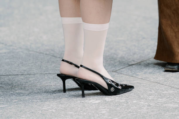 Guest is seen wearing long lace socks, black shoes during Rakuten Tokyo Fashion Week A/W 2025 on March 22, 2025 in Tokyo, Japan.