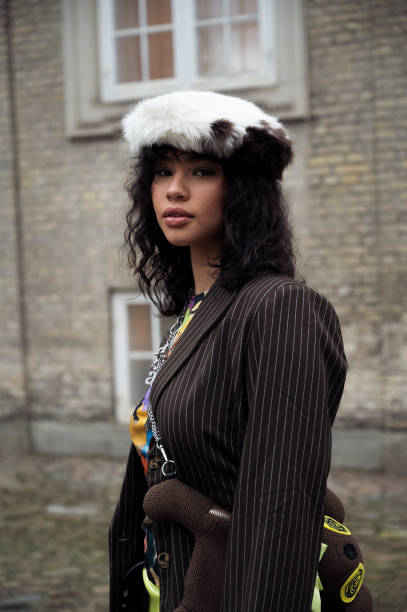 Guest wearing brawn jacket and brown and white fur beret outside Stine Goya in Copenhagen fashion week Autumn/Winter 2022 on February 02, 2022 in...