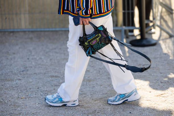 Guest wears Balenciaga bag outside Casablanca during the Womenswear Fall/Winter 2025/2026 as part of Paris Fashion Week on March 05, 2025 in Paris,...