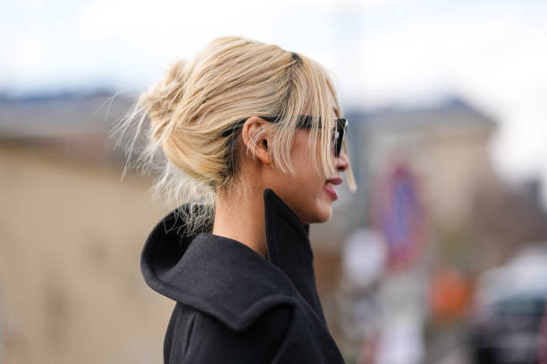 Guest wears black sunglasses, outside Ferragamo, during the Milan Fashion week Women's Fall/Winter 2025-2026 on March 1, 2025 in Milan, Italy.