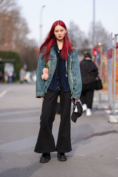 Guest wears burgundy bordeaux hair, navy blue fuzzy cardigan, navy blue denim jean jacket, black loose pants, shiny black loafer moccasin leather...