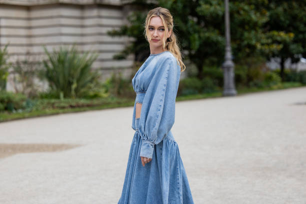Guest wears denim cut out dress outside Zimmermann during the Womenswear Fall/Winter 2025/2026 as part of Paris Fashion Week on March 10, 2025 in...