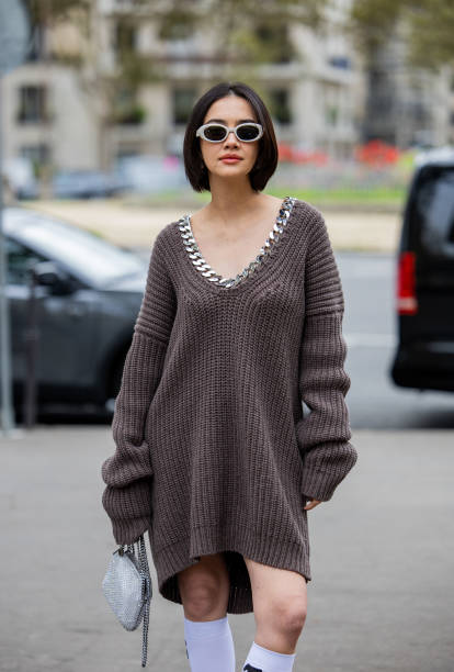 Guest wears grey knitted dress outside Stella McCartney during Womenswear Spring/Summer 2025 as part of Paris Fashion Week on September 30, 2024 in...