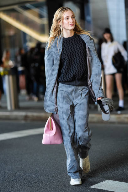 Guest wears light gray black pattern/print oversized blazer jacket, black and dark gray pattern sweater, light gray black pattern/print loose pants,...