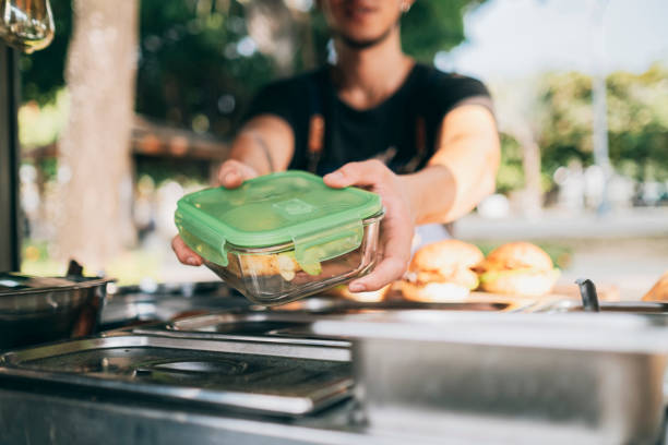 guests bring their own containers - junk food stock pictures, royalty-free photos & images