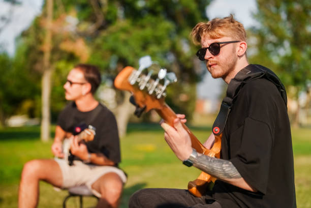 guitar player of the music band, outdoor music - concert stock pictures, royalty-free photos & images