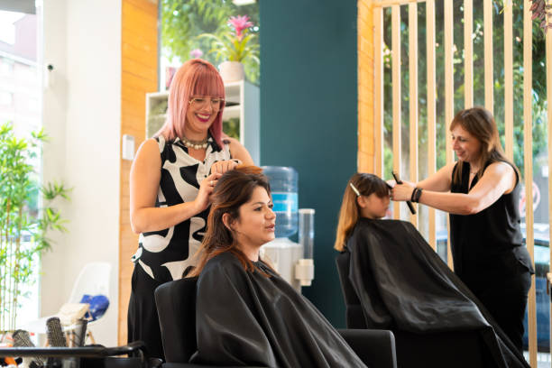 hairdressers working in a hair salon - hairstyle stock pictures, royalty-free photos & images