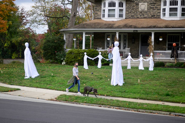 Halloween decorations stand on a front yard of a home in the Mt Airy neighborhood of Philadelphia, PA on October 24, 2020. The even is held to...