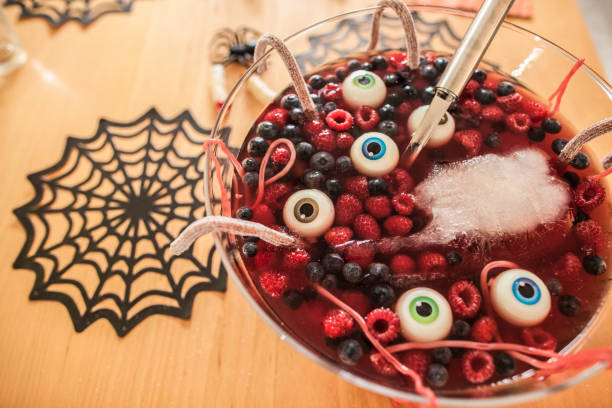 halloween dessert with berries and floating eyeballs, close-up - food stock pictures, royalty-free photos & images