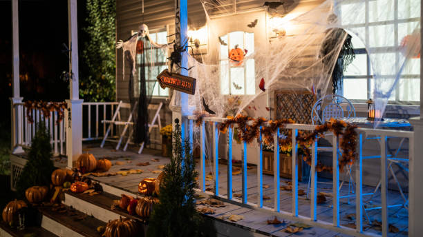 halloween jack-o-lantern pumpkins on a porch stairs - home decoration stock pictures, royalty-free photos & images