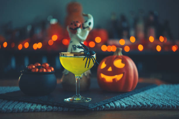 halloween time. vibrant colored drinks with cauldron of candy - home decoration stock pictures, royalty-free photos & images