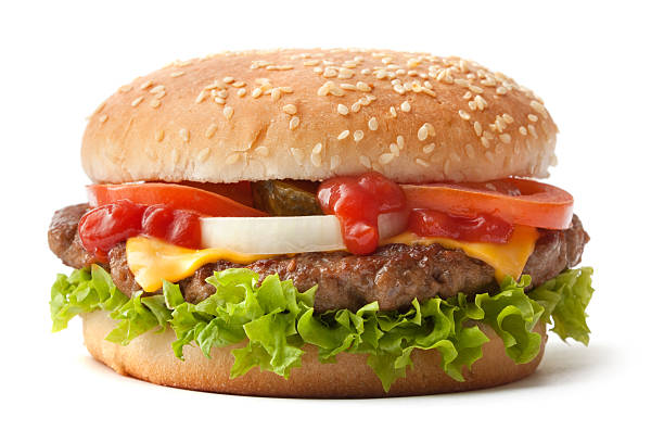 hamburger on sesame seed bun with fixings - junk food stock pictures, royalty-free photos & images