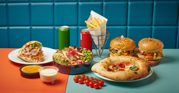 hamburgers and pizzas - junk food stock pictures, royalty-free photos & images