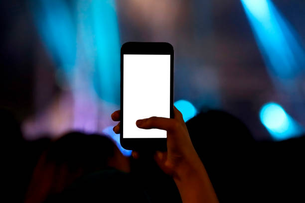 hand holding their smart phones and photographing concert - concert stock pictures, royalty-free photos & images