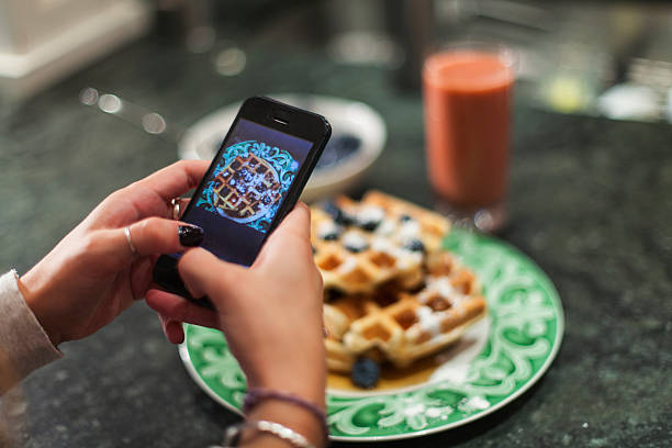 hand using smartphone to take photo of breakfast - food stock pictures, royalty-free photos & images