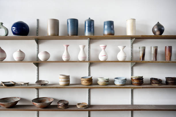 handmade ceramic vases and dishes on display in a shop - home decoration stock pictures, royalty-free photos & images