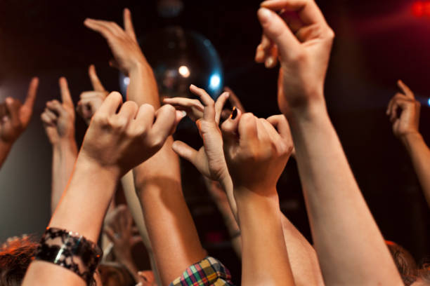 hands in the air at a nighclub - concert stock pictures, royalty-free photos & images