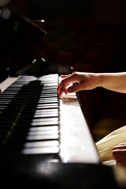 hands of female pianist playing piano,close up - concert stock pictures, royalty-free photos & images
