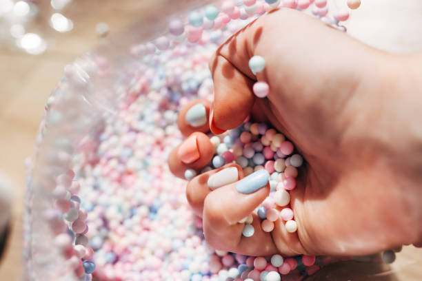 hands of young woman with beautiful manicure on color background - nails art stock pictures, royalty-free photos & images