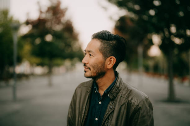 handsome japanese man at dusk, tokyo - fashion stock pictures, royalty-free photos & images