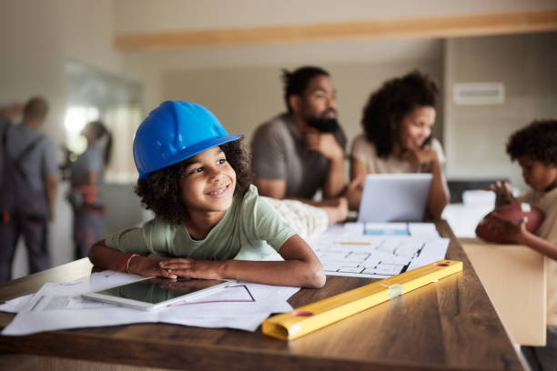 happy black girl enjoying at renovating home with her family. - home decoration stock pictures, royalty-free photos & images