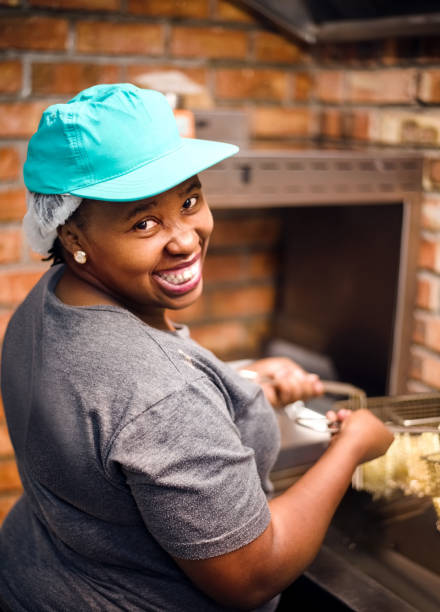 happy chef in kitchen - junk food stock pictures, royalty-free photos & images