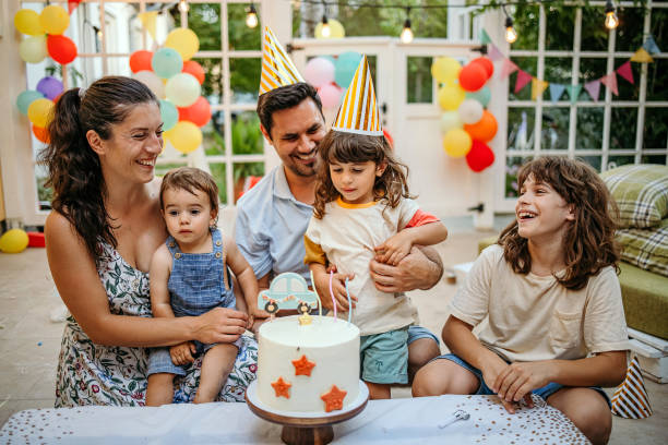 happy family at a birthday party - garden decoration stock pictures, royalty-free photos & images