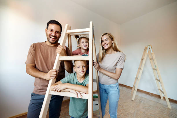 happy family during home renovation process. - home decoration stock pictures, royalty-free photos & images