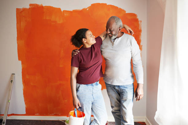 happy family renovating home together= - home decoration stock pictures, royalty-free photos & images