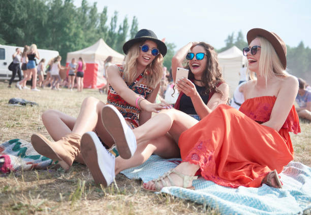 happy friends making selfie at music festival - concert stock pictures, royalty-free photos & images