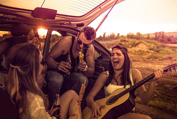 happy hipsters on a road trip - concert stock pictures, royalty-free photos & images