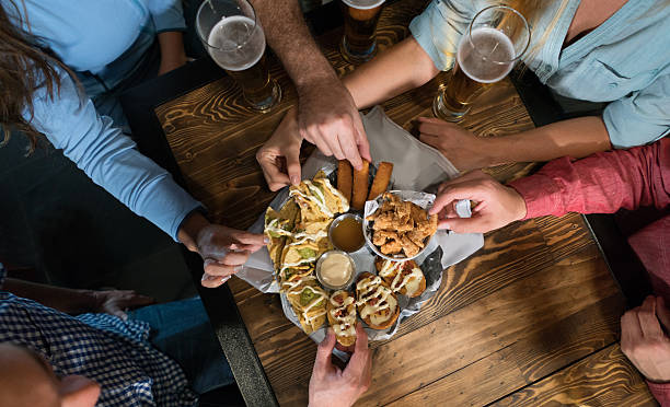 happy hour at the bar - food stock pictures, royalty-free photos & images