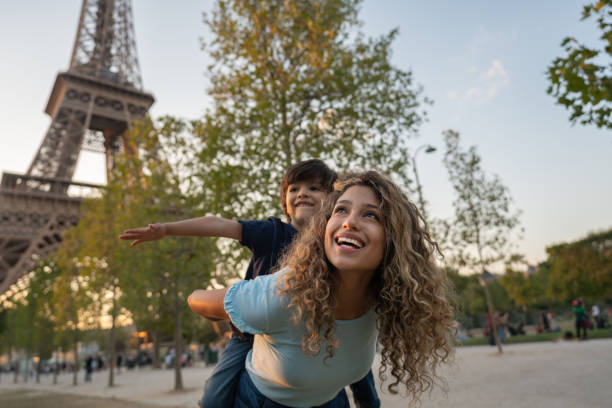 happy mother and son traveling to paris - travel stock pictures, royalty-free photos & images