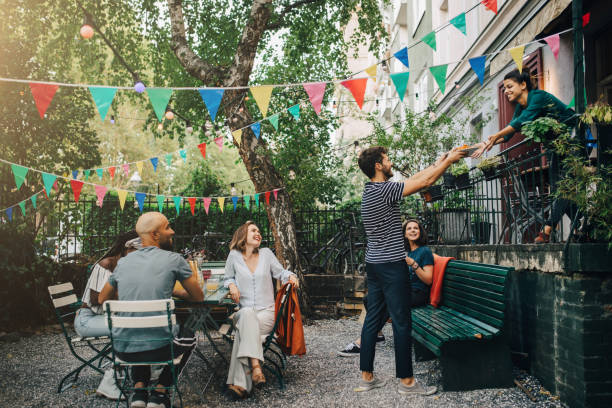 happy multi-ethnic friends in backyard during garden party - garden decoration stock pictures, royalty-free photos & images