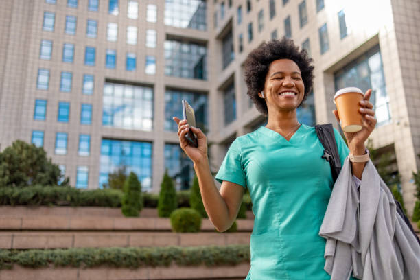 happy relaxed medical practitioner dancing outdoors. - travel stock pictures, royalty-free photos & images