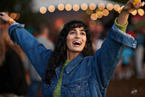 happy woman dancing to music - concert stock pictures, royalty-free photos & images