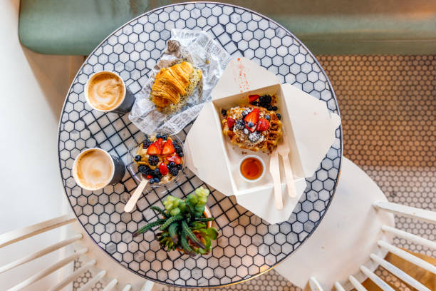 healthy breakfast prepared for takeaway from a cafe, directly above view - junk food stock pictures, royalty-free photos & images